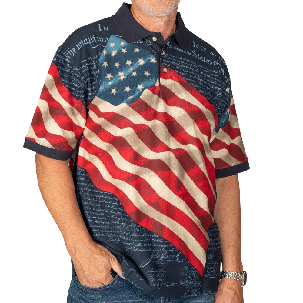 Men's patriotic polo shirt featuring American flag design with Declaration of Independence text on navy blue background
