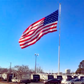 "Large-scale American flag on high-mast pole - Freedom Grand Series flags made in USA for stadiums, military bases, and monumental display"