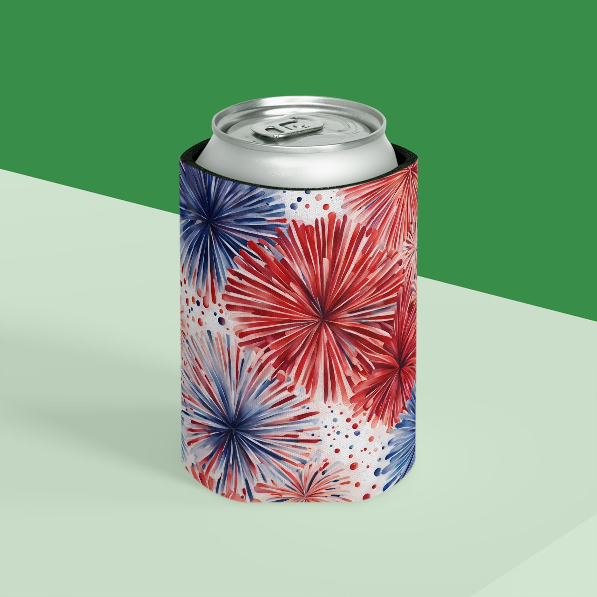 Can cooler with red and blue FIREWORK pattern on a green and white background