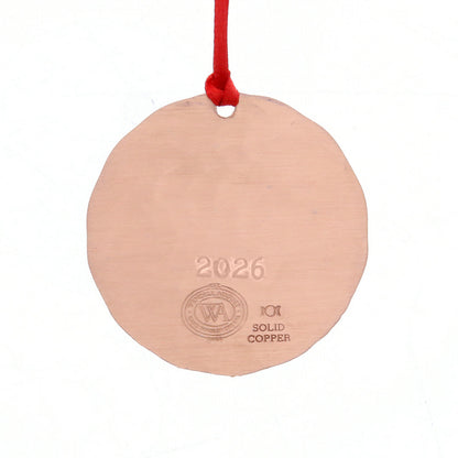 Back of Wendell August Forge Round solid copper ornament with '2026' engraving and red string on a white background