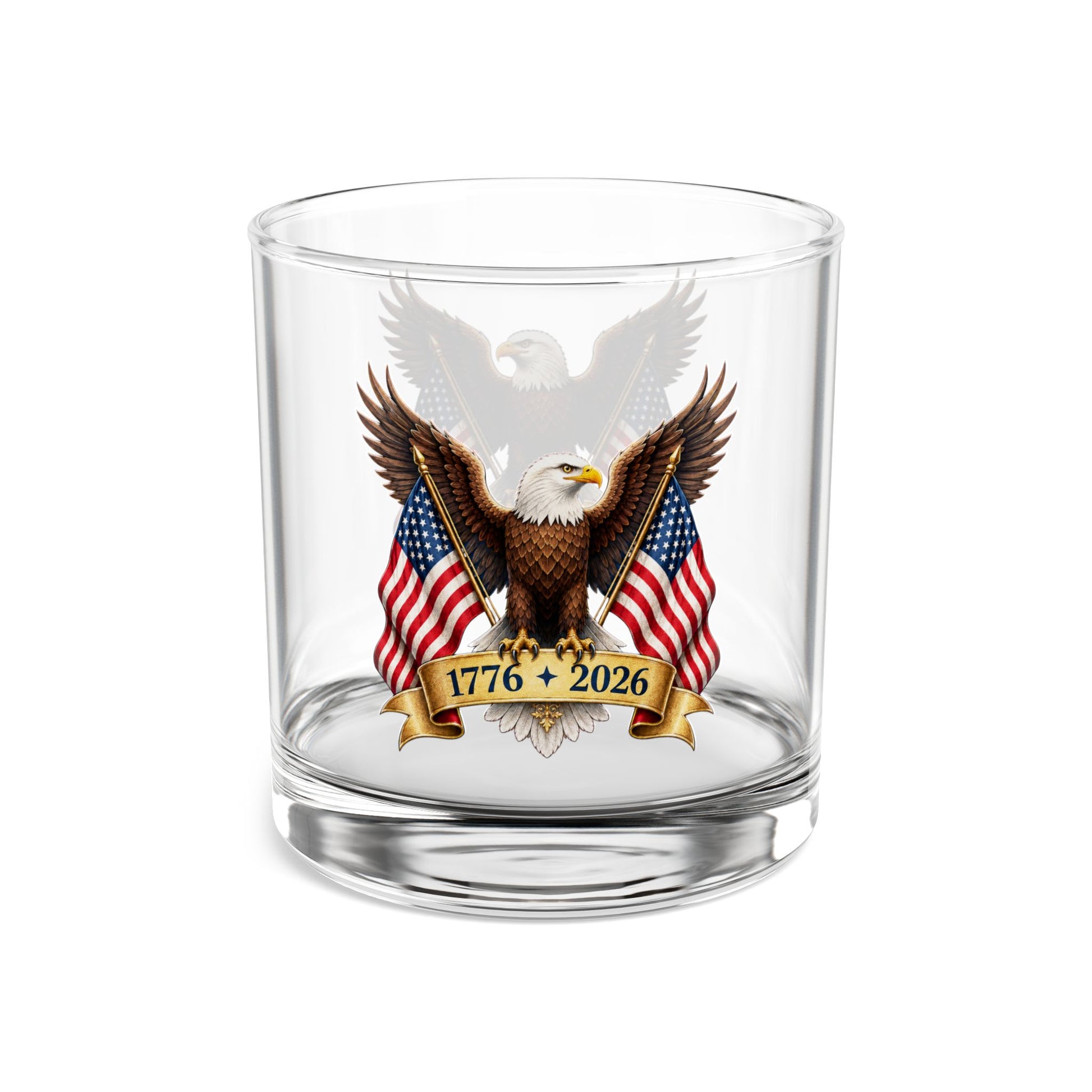 Clear whiskey glass with an eagle and American flag design on a white background