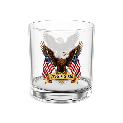 Clear whiskey glass with an eagle and American flag design on a white background