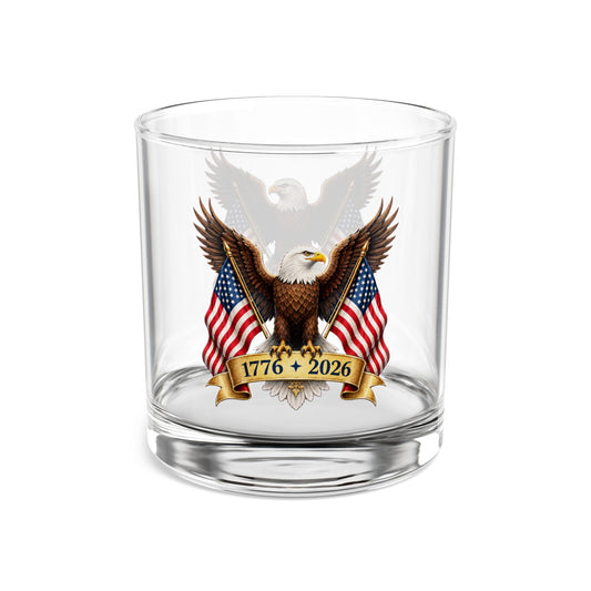 Clear whiskey glass with an eagle and American flag design on a white background