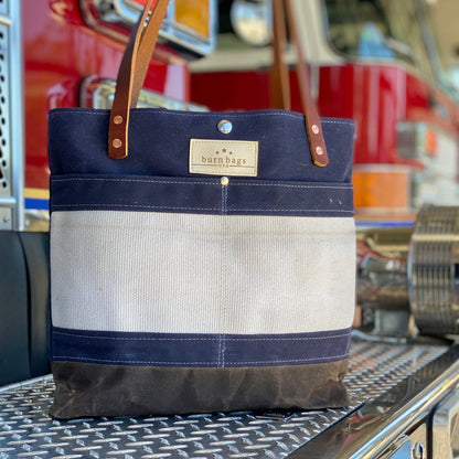 Navy Blue Classic Burn Bag made from reclaimed fire hose with waxed canvas and leather straps.