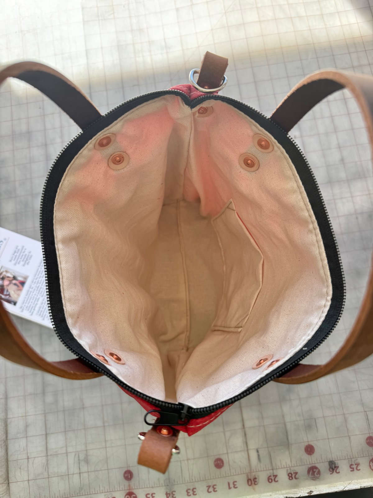 Interior view of Charcoal Engineer Burn Bag showing full lining and multiple interior pockets.