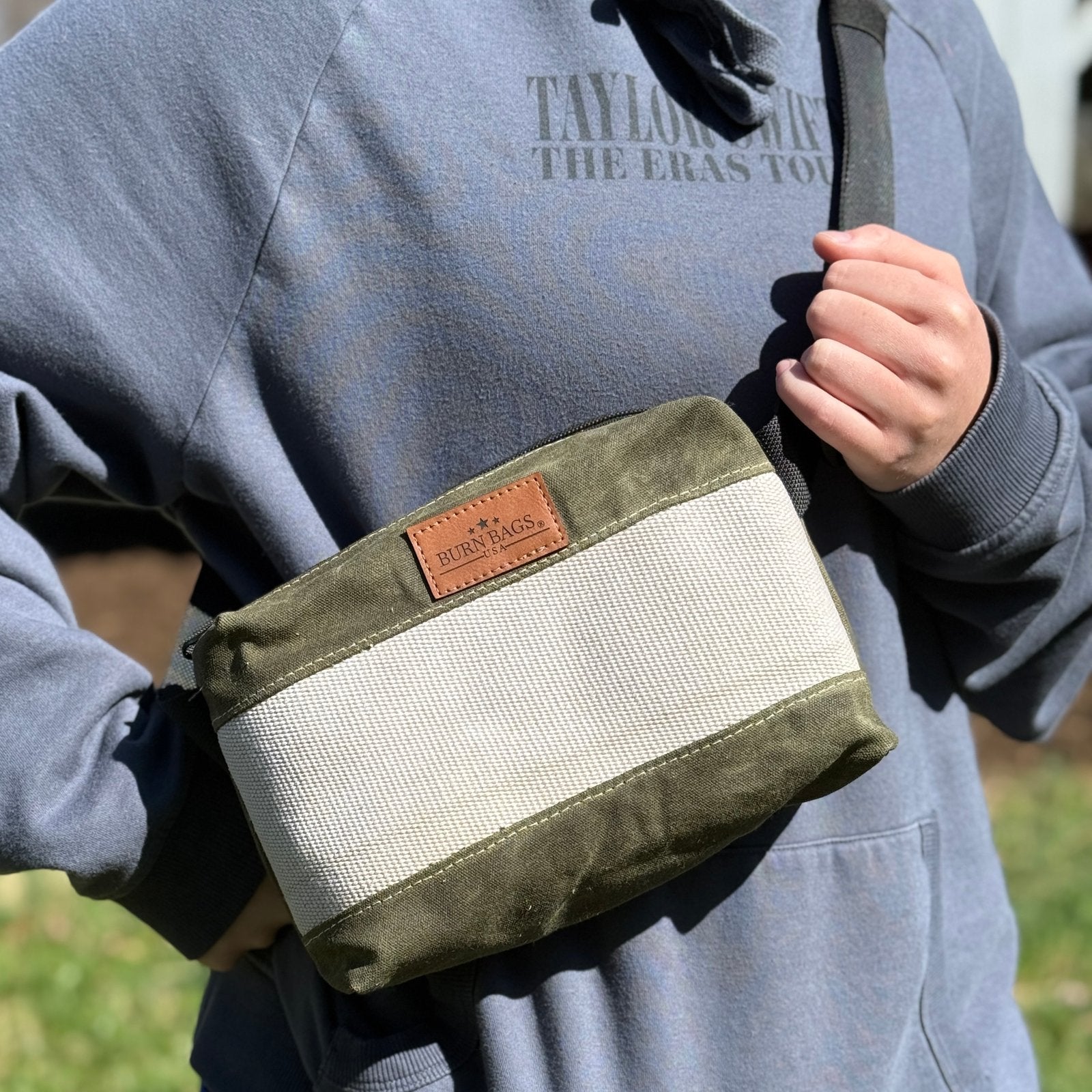 Olive Green Fanny Pack made from decommissioned fire hose and waxed canvas with adjustable strap for waist or crossbody wear.