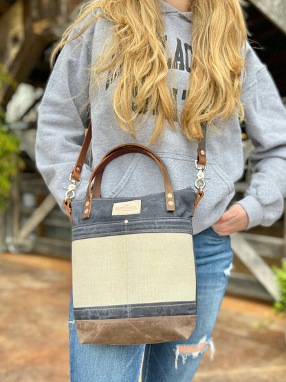 Charcoal Engineer Burn Bag made from waxed canvas and decommissioned fire hose with reinforced front panel and leather carry straps