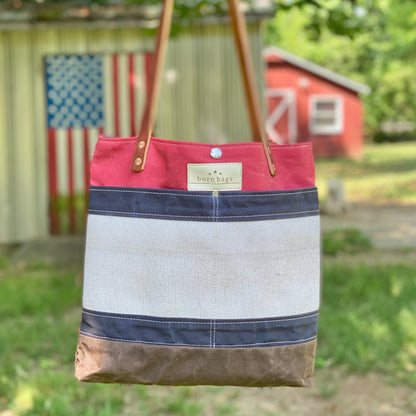 Patriotic Classic Burn Bag with decommissioned fire hose panel and leather strap.