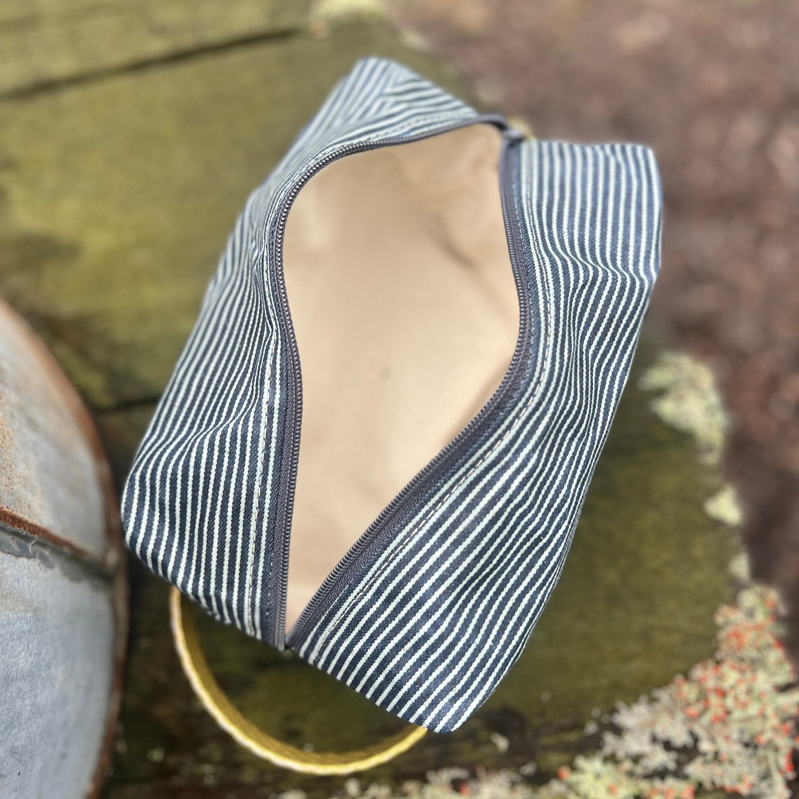 Interior view of Hickory Striped Pouch showing full lining and space for small essentials.