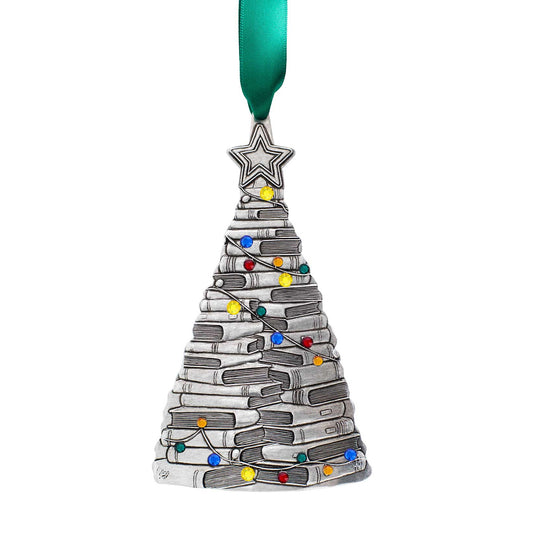 A silver Christmas tree ornament shaped like a stack of books, decorated with small multicolored lights and a green ribbon…