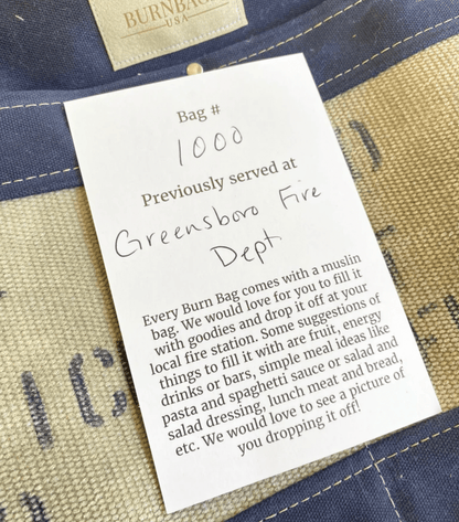 Authenticity card showing fire hose origin attached to interior of Burn Bag.