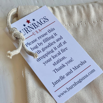 Close-up of the authenticity card attached to the Wine Carrier, showing the fire hose origin information and stitching detail.