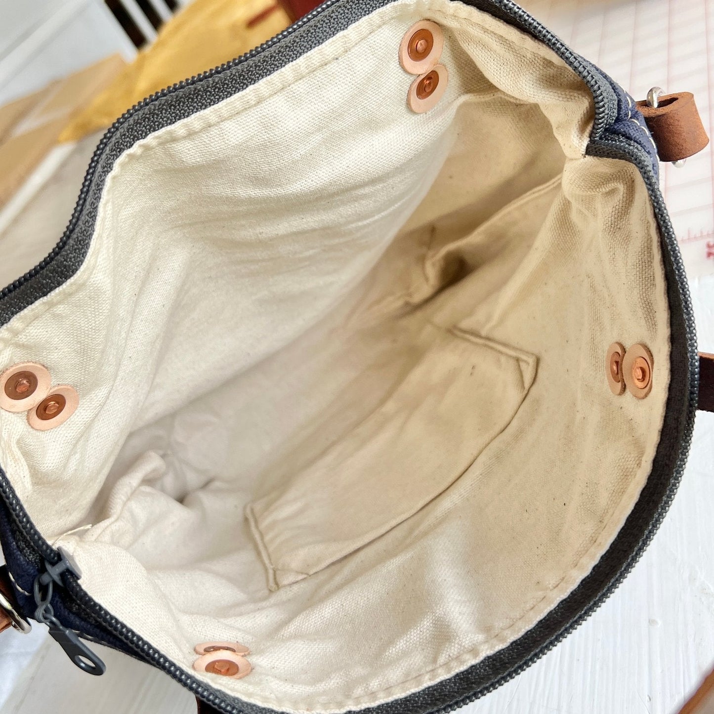 Interior view of Charcoal Gray Crossbody Burn Bag showing full lining and zipper opening.
