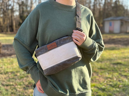 Charcoal Fanny Pack made from decommissioned fire hose and waxed canvas with adjustable strap for waist or crossbody wear.