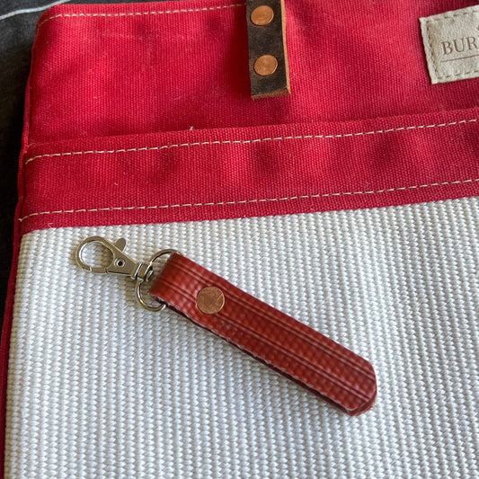 Close-up of the Fire Hose Key Chain showing hose texture and stitching.