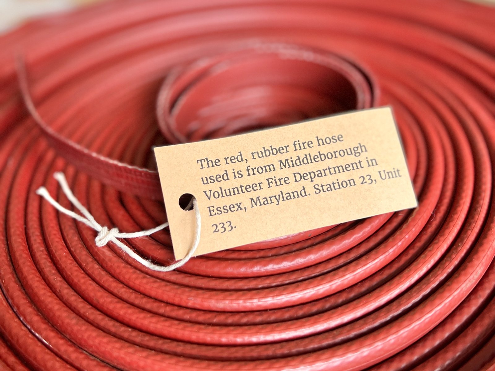 Authenticity card included with the Fire Hose Belt showing the hose’s fire department origin.