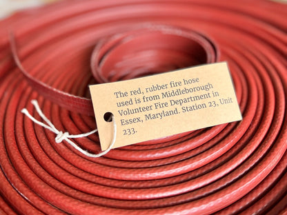 Authenticity card included with the Fire Hose Belt showing the hose’s fire department origin.